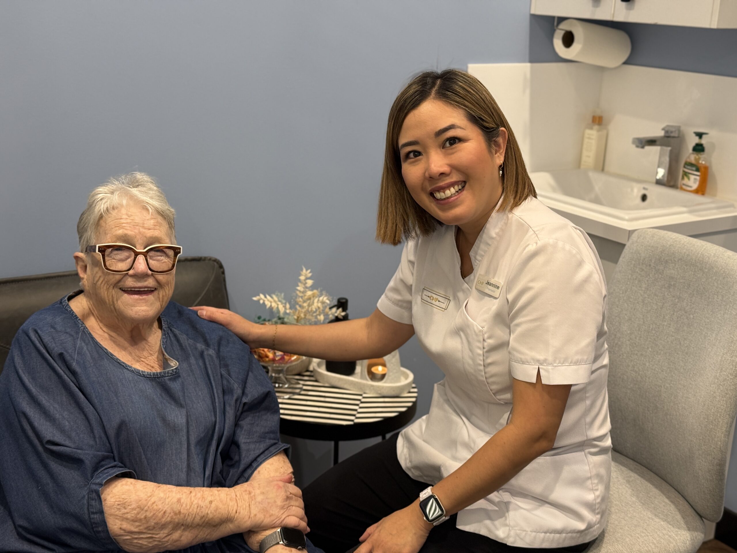 Pharmacist and patient smiling after flu vaccination at Coorparoo Marketplace Pharmacy